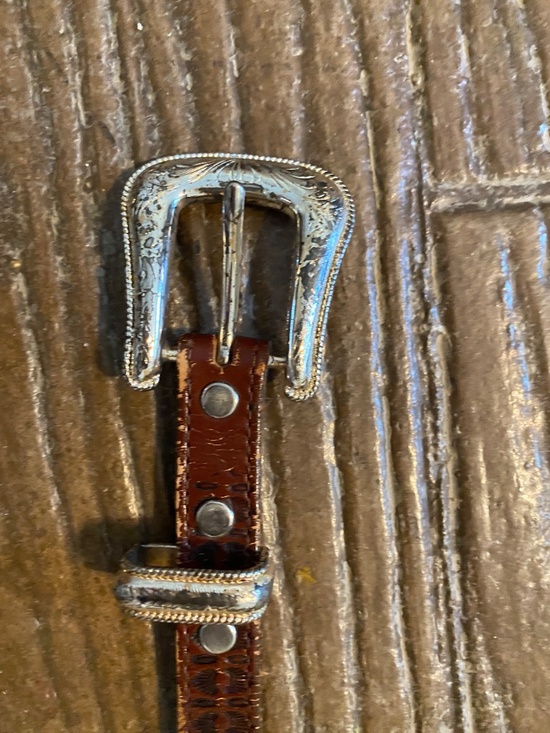 Brown Western leather concho belt. Bought in Jackson Hole, Wyoming years ago